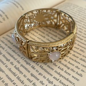 Beautiful gold tone bracelet with pink tone faux gems